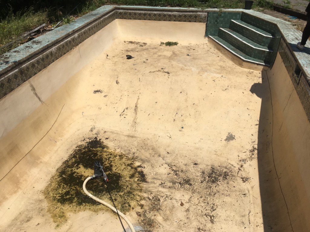 Incredibly dirty and damaged pool